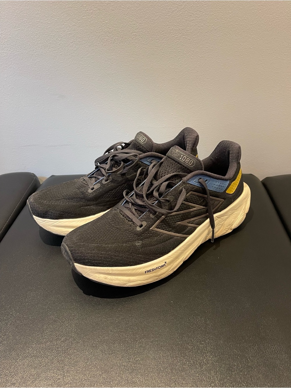 New Balance Men's Running Shoes in Black with Blue and Yellow Accents